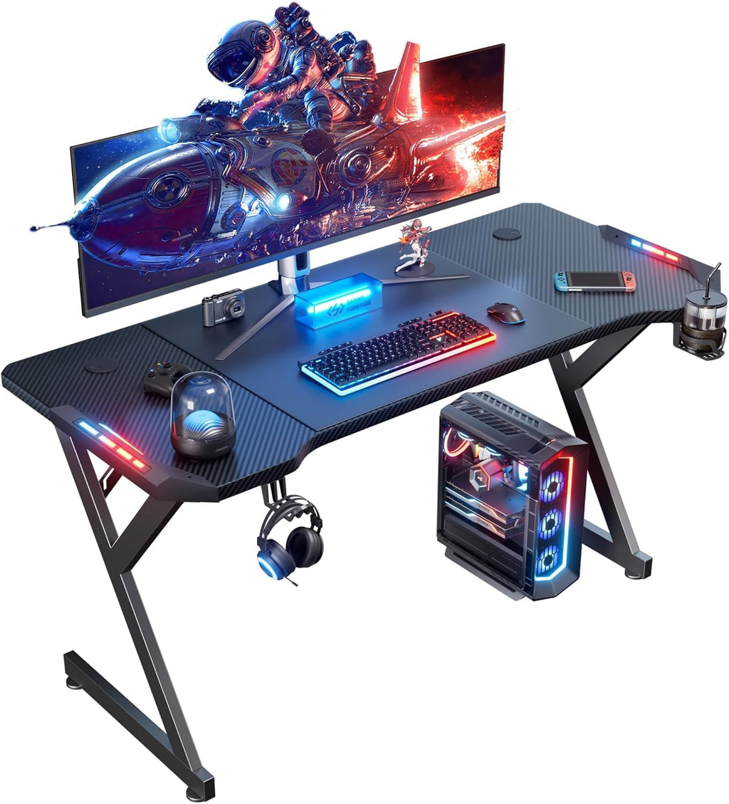 Bureau de jeu HLDIRECT de 55 pouces avec lumières LED, table de jeu informatique ergonomique avec surface en fibre de carbone, bureau de travail robuste pour jeux et bureau à domicile avec crochet pour casque et porte-gobelet, Noir